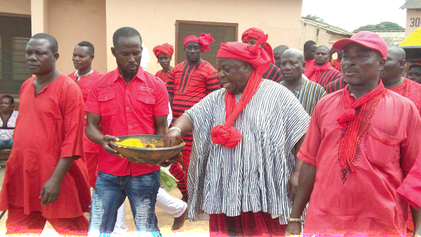 Tema Mantse Nii Adjei Krakue II sprinkling Kpokpoi on the streets of Tema Tema Mantse Nii Adjei Krakue II sprinkling Kpokpoi on the streets of Tema