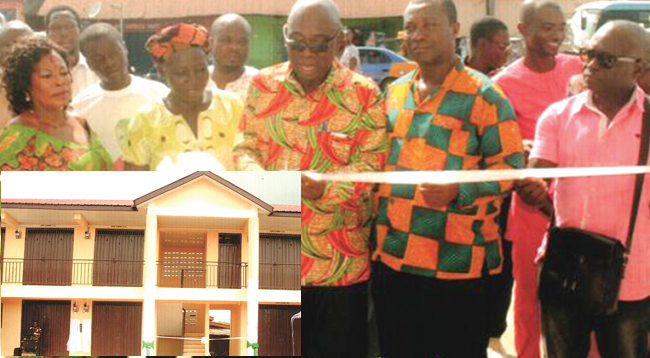 The District Chief Executive for Atiwa, Mr Atta Twum, cutting the tape to inaugurate the lockable stores at Anyinam. Looking on are some officials of the assembly and market women. Inset: the lockable stores Atiwa District benefits from social amenities