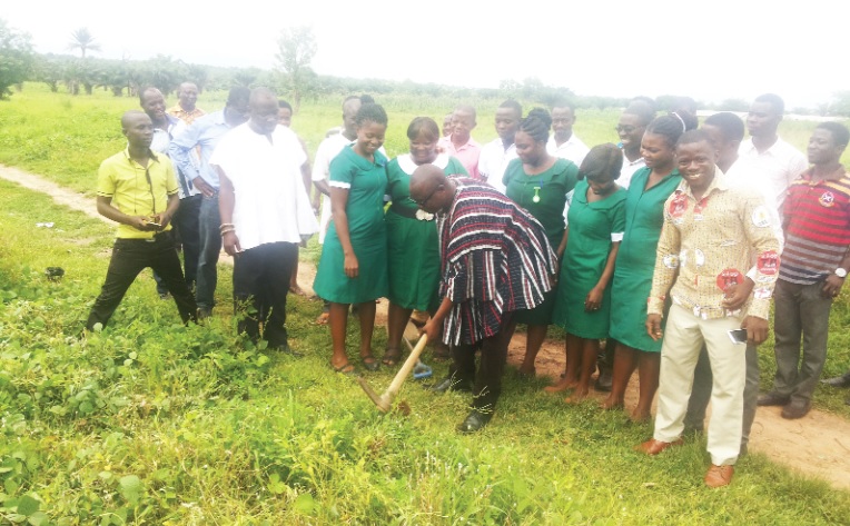 Mr Martin Kudor Kidibi cutting the sod for the nurses' quarters and water project. Mr Martin Kudor Kidibi cutting the sod for the nurses' quarters and water project.