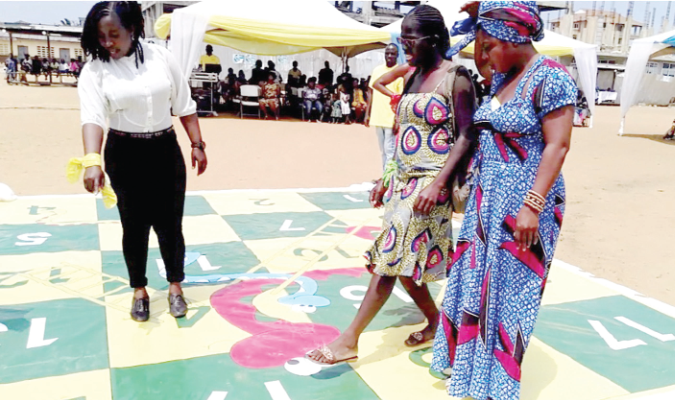 Some mothers playing a nutrition game.