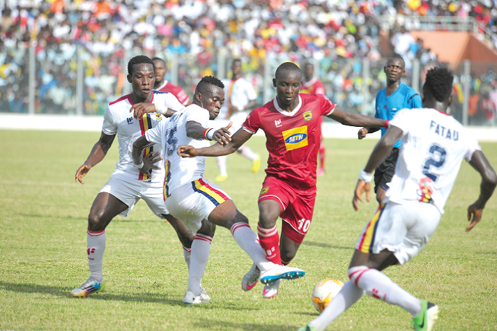 Flashback: Asante Kotoko striker Dauda Mohammed takes on two Hearts players during the first round match in Accra. Flashback: Asante Kotoko striker Dauda Mohammed takes on two Hearts players during the first round match in Accra.