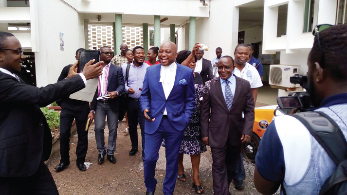 Mr Eric Amoateng (right) leaving the court premises with smiles after his acquittal Mr Eric Amoateng (right) leaving the court premises with smiles after his acquittal