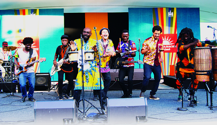 Pat Thomas (behind bongos) and the Kwashebu Area Band on stage. Pat Thomas (behind bongos) and the Kwashebu Area Band on stage.