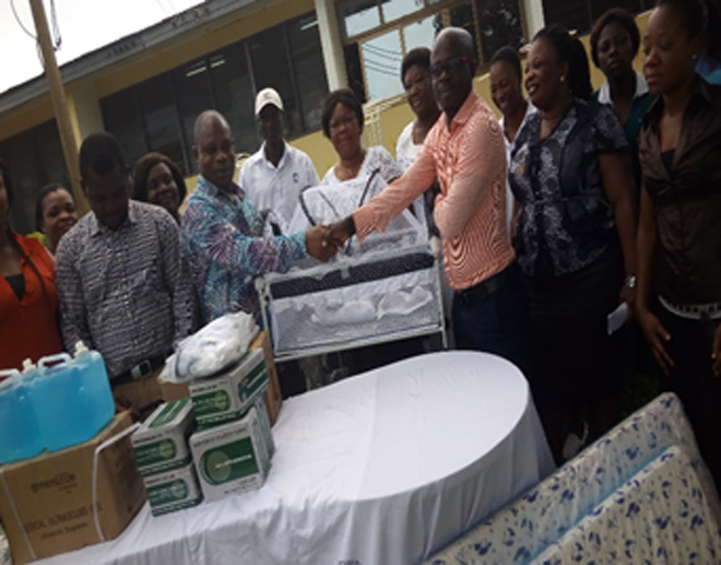 Mr Michael Peprah, (third right), the Finance Manager of the company, making the presentation to Dr Anderson Mr Michael Peprah, (third right), the Finance Manager of the company, making the presentation to Dr Anderson