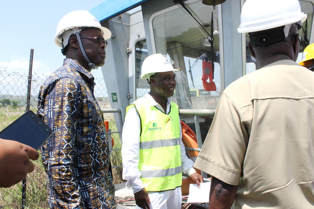 Mr Alexader Margotey (midle), Operations Manager of Seaweld Engineering Limited, briefing Mr Fifi Kwetey (left), Minister of Transport, on the progress of work. Rodents damage electrical cables of ferries on Volta Lake