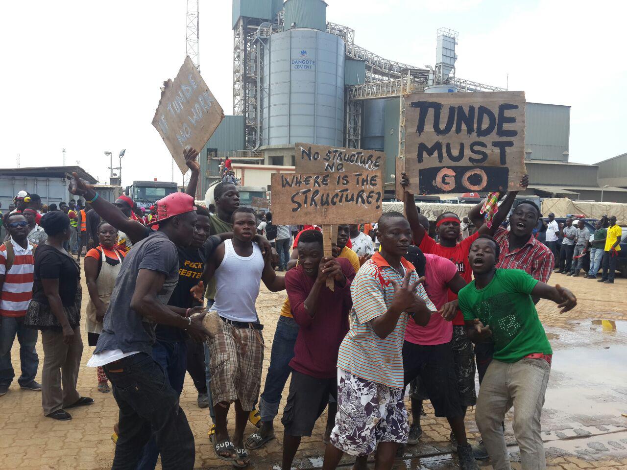 Some workers carrying placards Dangote workers demonstrate over conditions of service