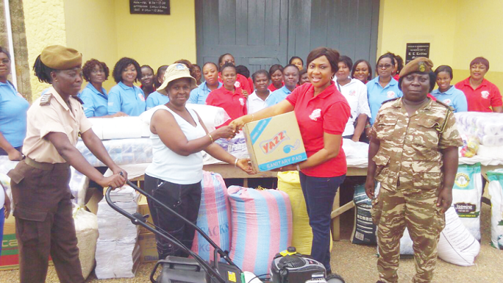 Lady Rev Mrs Perpetual Ampomah-Boateng ( second right) leader of the Women Ministry of the Global Peace Christian Centre presenting items to Mrs Sophia Osei-Bonsu, Chief Supt of Prisons, at the Nsawam Female Prison in the Eastern Region. ‘Women of virtue’ donate to Nsawam Female Prison