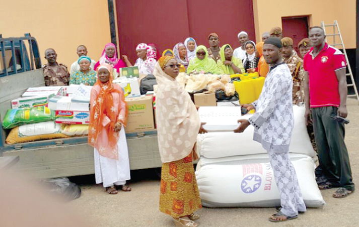 Hajia Rukayatu Iddriss (left), President of the Annisaa Foundation, presenting a box of dates to the Imam of the Nsawam Medium Prison, DSP Adam. Annisaa Foundation supports Nsawam Prison