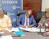 Muntaka Mohammed-Mubarak (left), Minister for the Interior, alongside Haruna Iddrisu, Minister for Education, and Patience Baffoe-Bonnie (right), Director-General of Prisons, signing the memorandum of understanding. Picture: ELVIS NII NOI DOWUONA 
