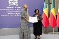  Isaline Attely, an Afro-descendant from Martinique, receiving her certificate of Beninese nationality during a naturalisation ceremony in Cotonou, Benin 