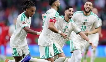 Riyad Mahrez and teammates celebrating Algeria's victory over Sudan
