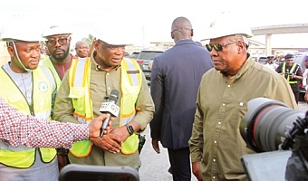 Kwame Governs Agbodza (2nd from left), Minister of Roads and Highways, explaining a point to President John Dramani Mahama (right) during  a working inspection of the project