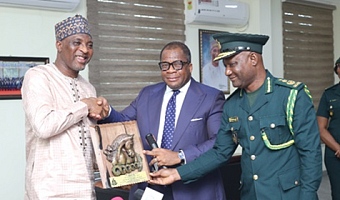 Rev. Stephen Wengam (middle), Chairman, GIS Governing Council, presenting a plaque to Muntaka Mohammed-Mubarak (left), Minister for the Interior. Assisting him is Samuel Basintale Amadu, Comptroller-General of Immigration. Picture: BENEDICT OBUOBI