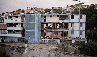 A damaged building following U.S. strikes on Venezuela, during which President Nicolas Maduro and his wife, Cilia Flores, were captured, in Catia La Mar, Venezuela, January 4, 2026. REUTERS/Gaby Oraa