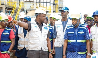 Edmond Kombat (3rd from left), MD of TOR, explaining a point to Godwin Edudzi Tameklo (2nd from right), CEO of the NPA, and the delegation and staff of TOR during a tour of the refinery