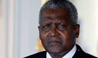 Nigerian multinational industrial conglomerate Dangote Group's CEO Aliko Dangote looks on as he attends a meeting during the seventh 