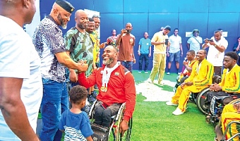 Yaw Ampofo Ankrah, NSA boss exchanging pleasantries with Raphael Botsyo Nkegbe, one of the para athletes