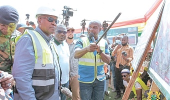 President John Dramani Mahama (left) being briefed on the artist’s impression of the projects