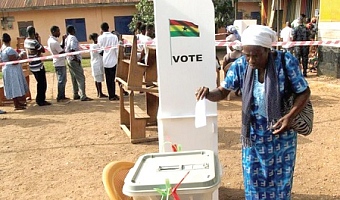 A voter casting her ballot in a general election
