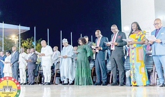 Rev. Stephen Wengam (right) in the company of President John Dramani Mahama (7th from right), Alban Bagbin (6th from right), Speaker of Parliament, and other dignitaries during the service