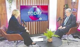 Antonio Guterres (right) being interviewed by a BBC reporter