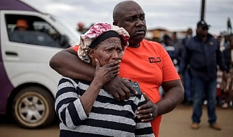 Bekkersdal residents at the scene of the shooting
