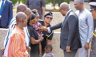 President John Dramani Mahama (2nd from right) consoling some family members of the fallen officers during the ceremony