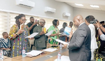 Members of the governing board taking the oath of office