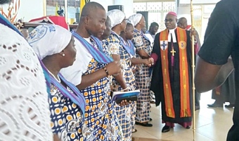 Presiding Bishop of The Methodist Church Ghana, Most Rev. Professor Johnson Kwabena Asamoah-Gyadu, congratulating the new Connexional officers of the Guild