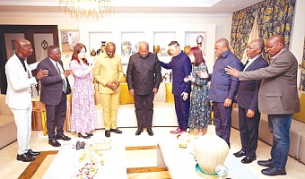 Rev. Dominic Yeo (5th from right) and his delegation praying for President John Dramani Mahama