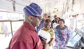 Vice-President Naana Jane Opoku-Agyemang (right) and some officials on one of the buses