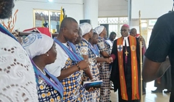 Most Rev Professor Johnson Kwabena Asamoah-Gyadu, Presiding Bishop of The Methodist Church Ghana, congratulating connexional officers of the Methodist Guild after their induction