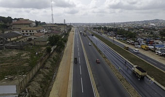 Kwame Governs Agbodza (2nd from left), Minister of Roads and Highways, explaining a point to President John Dramani Mahama (right) during  a working inspection of the project
