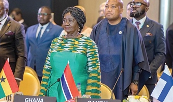 Prof. Naana Jane Opoku-Agyeman, Vice-President, observing a salute at the AU-EU Summit in Angola. With her is Samuel Okudzeto Ablakwa, Minister of Foreign Affairs