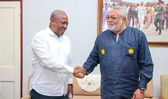 President John Mahama (left) in a handshake with late President Jerry John Rawlings during an event