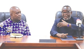 Justice Paul Baffoe-Bonnie (right), Chief Justice, explaining a point to Prof. Ahmed Jinapor, Director-General, GTEC, during the courtesy call