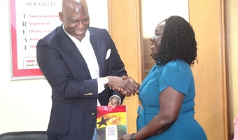 Ato Afful (left), MD, GCGL, presenting the Ghana Year Book to Dr Enyonam Kpekpena, Executive Director, GhIE.  Picture: ESTHER ADJORKOR ADJEI 