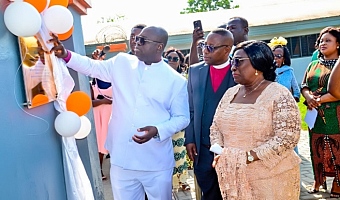 Rt Rev. Dr Abraham Nana Opare Kwakye, Moderator of General Assembly, PCG, unveiling the plaque for the newly named ROSEMOND BAMPO HOUSE. With him are other officials