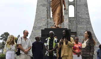 Rocky Dawuni (2nd from right), renowned Ghanaian musician, expaining a piont to some guests at an event at the Kwame Nkrumah Memorial Park