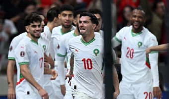 Morocco’s Brahim Díaz celebrates with teammates following the quarter-final win over Cameroon