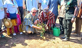 Rune Skinnebach (left), EU Ambassador to Ghana, being supported by Ali Adolf John, Northern Regional Minister, to plant a tree to officially launch the project