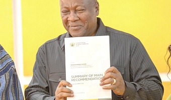 President John Dramani Mahama with the report 