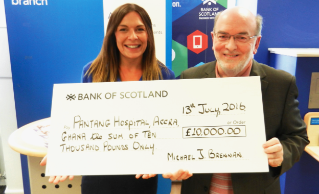 Mr Michael Brennan presenting the cheque for the Pantang Hospital overseas payment to Ms Sarah Horsburgh, Manager of the Bank of Scotland, Morningside Branch, Edinburgh Scottish lecturer raises £10,000 for Pantang Psychiatric Hospital