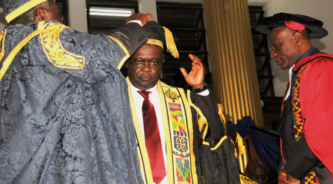 Justice Professor Samuel Date-Bah (let), Chairman of the University Council, decorating Professor Ebenezer Oduro Owusu (middle), the newly appointed Vice Chancellor of the UG, at a ceremony in Accra. Looking on is Rev. Professor Cephas Omenyo, Chairman, Chaplaincy Board. Picture: GABRIEL AHIABOR Minister swears in University of Ghana Governing Council