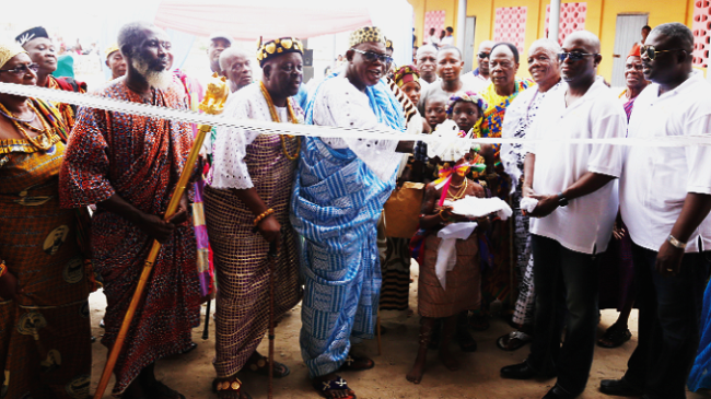 Togbui Agbesi-Awusi II, Awadada of Anlo State (4th left), together with Dr Quincy Attipoe (2nd right) cutting the tape to inaugurate the ICT centre NGO constructs ICT centre for Anyako primary school