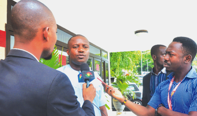 Mr John Jinapor (right), a Deputy Minister for Power, speaking to the media after a meeting in Accra. Picture: SAMUEL TEI ADANO VRA workers against ceding of assets : But Jinapor says claim untrue