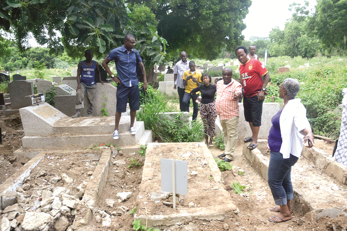Some family members of the deceased show their anger at the desecration of the grave Some family members of the deceased show their anger at the desecration of the grave