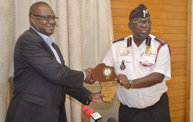 Dr Albert Brown Gaisie,Chief Fire Officer, presenting the award to Mr Prosper Bani, Minister of Interior. Picture: Emmanuel Quaye 