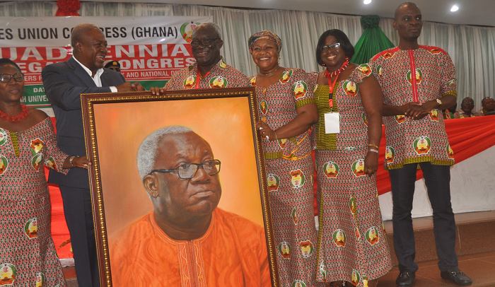 President Mahama (2nd left), on behalf of members of the TUC, presenting a portrait to Mr Kofi Asamoah (3rd left), Secretary-General, TUC, for his dedicated service, during the TUC’s 10th Quadrennial Delegates Congress in Kumasi. Those with them are Mr Haruna Iddrisu (right), the Minister of Employment and Labour Relations, and some members of the TUC. Picture: EMMANUEL BAAH President Mahama (2nd left), on behalf of members of the TUC, presenting a portrait to Mr Kofi Asamoah (3rd left), Secretary-General, TUC, for his dedicated service, during the TUC’s 10th Quadrennial Delegates Congress in Kumasi. Those with them are Mr Haruna Iddrisu (right), the Minister of Employment and Labour Relations, and some members of the TUC. Picture: EMMANUEL BAAH