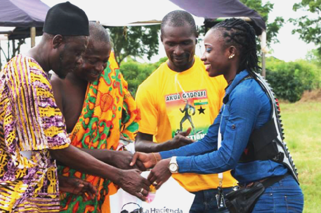 Akua Gaddafi (right) presenting the items to Chief of the Anapansu Nana Kwesi Essel Akua Gaddafi supports community